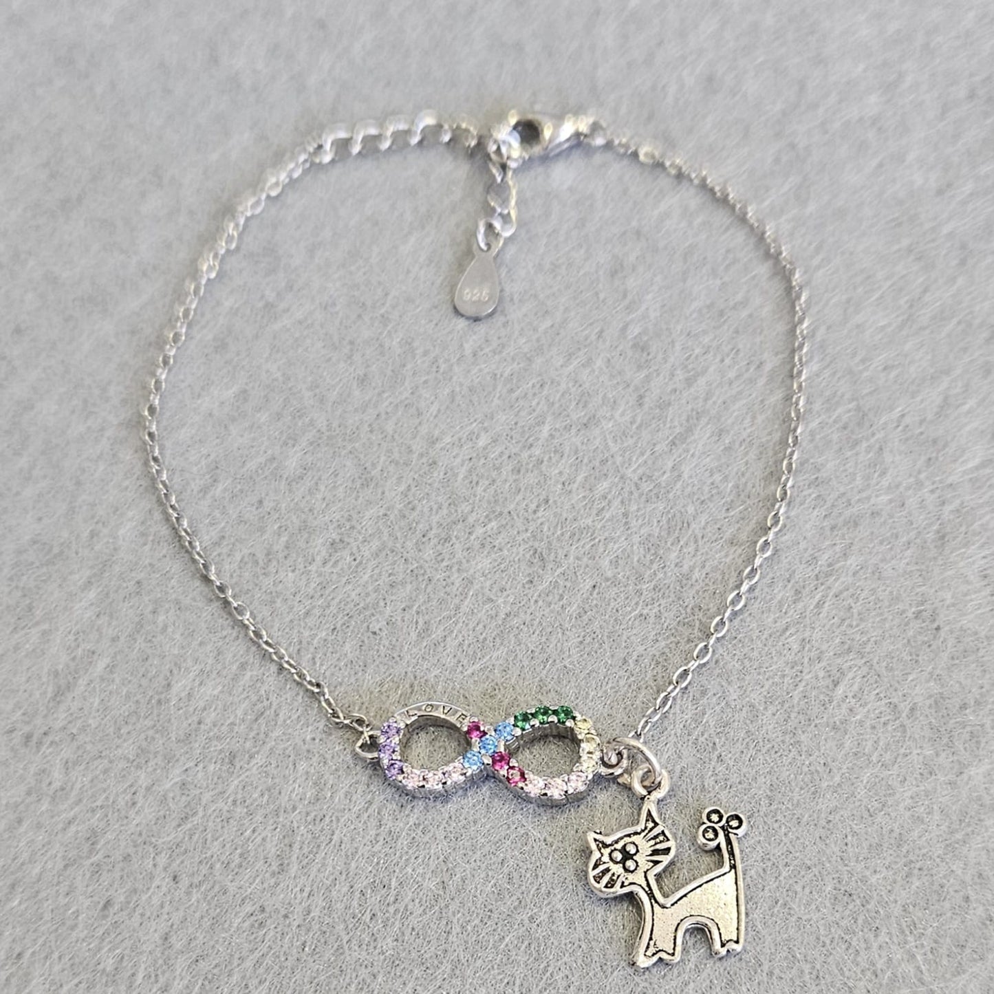 Pulsera de Plata de Ley rodiada con infinito y circonitas de colores