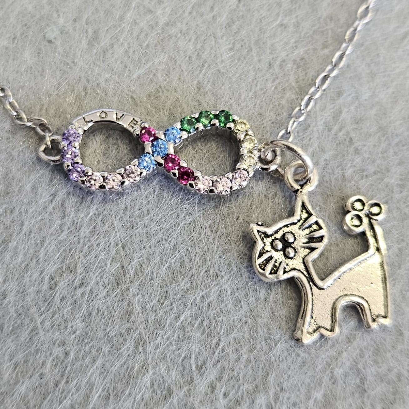 Pulsera de Plata de Ley rodiada con infinito y circonitas de colores