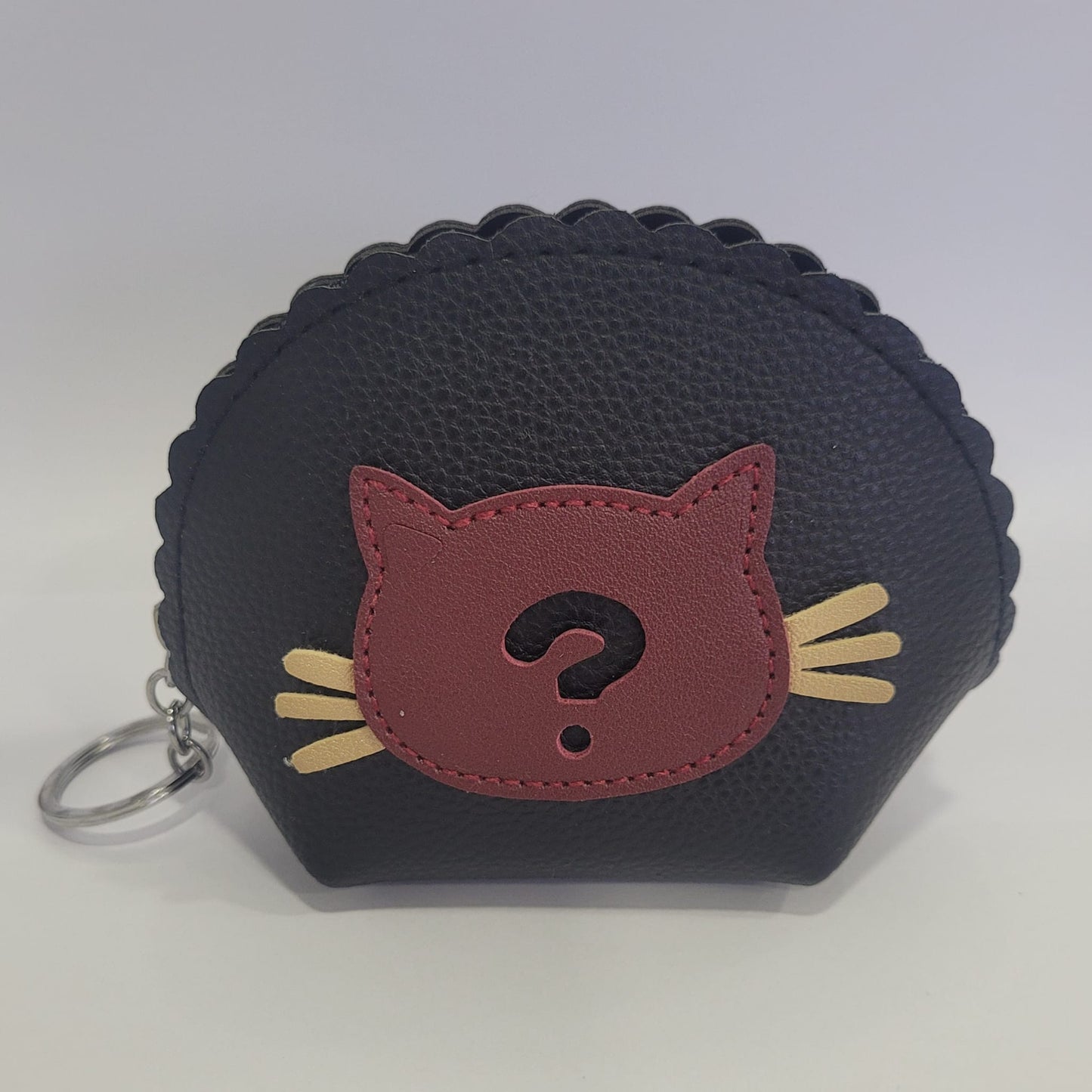 Monedero en diferentes colores con cabeza de gatito