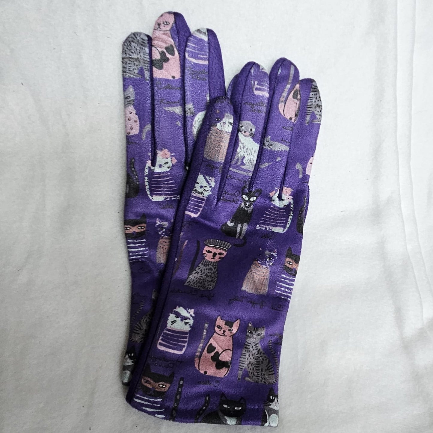 Guantes táctiles estampado colorido de gatitos fondo morado