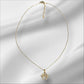 Collar de acero con charm de huella dorado
