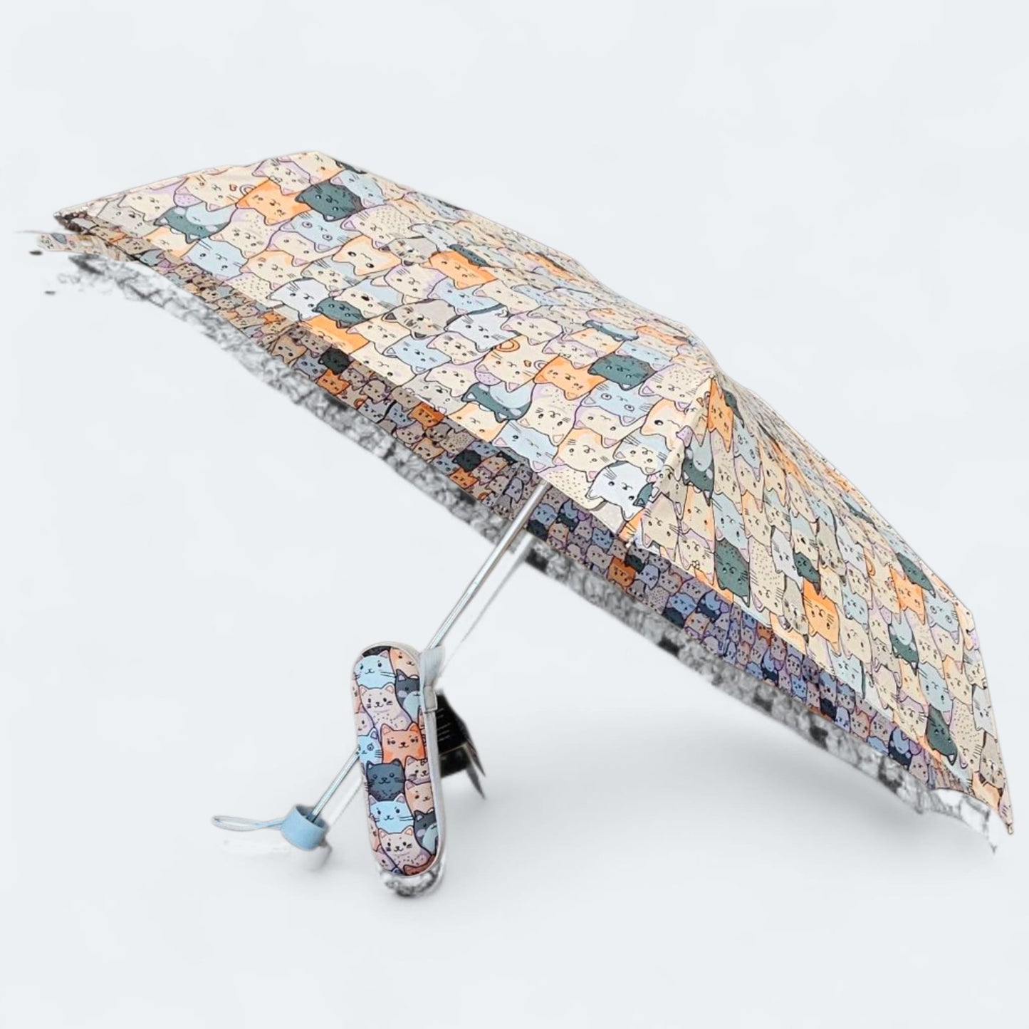 Paraguas plegable con funda rígida antiviento – mango azul.