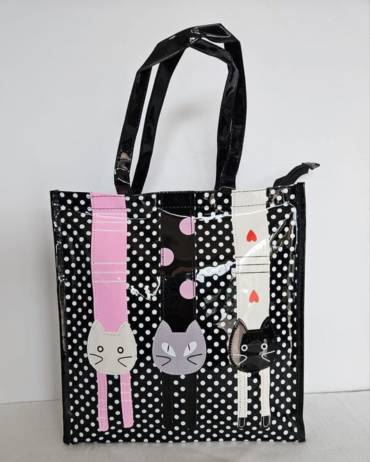 Bolsa Tote-bag plastificada en color negro con lunares y dibujo de cabeza de gatitos