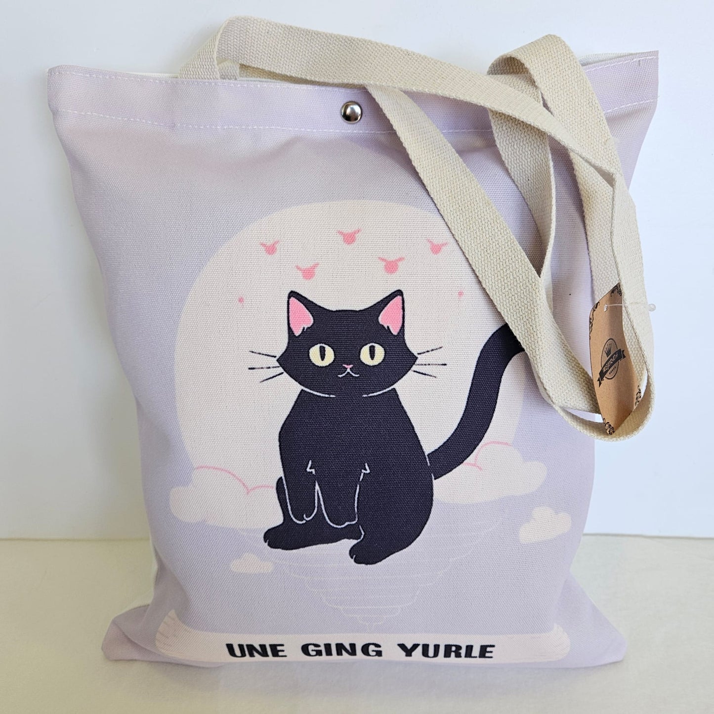 Bolsa tote bag de tela estampado gatito con frase "UNE GING YURLE"