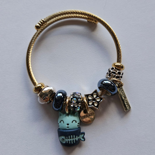 Pulsera de acero en dorado tipo Pandora con charms de color azul